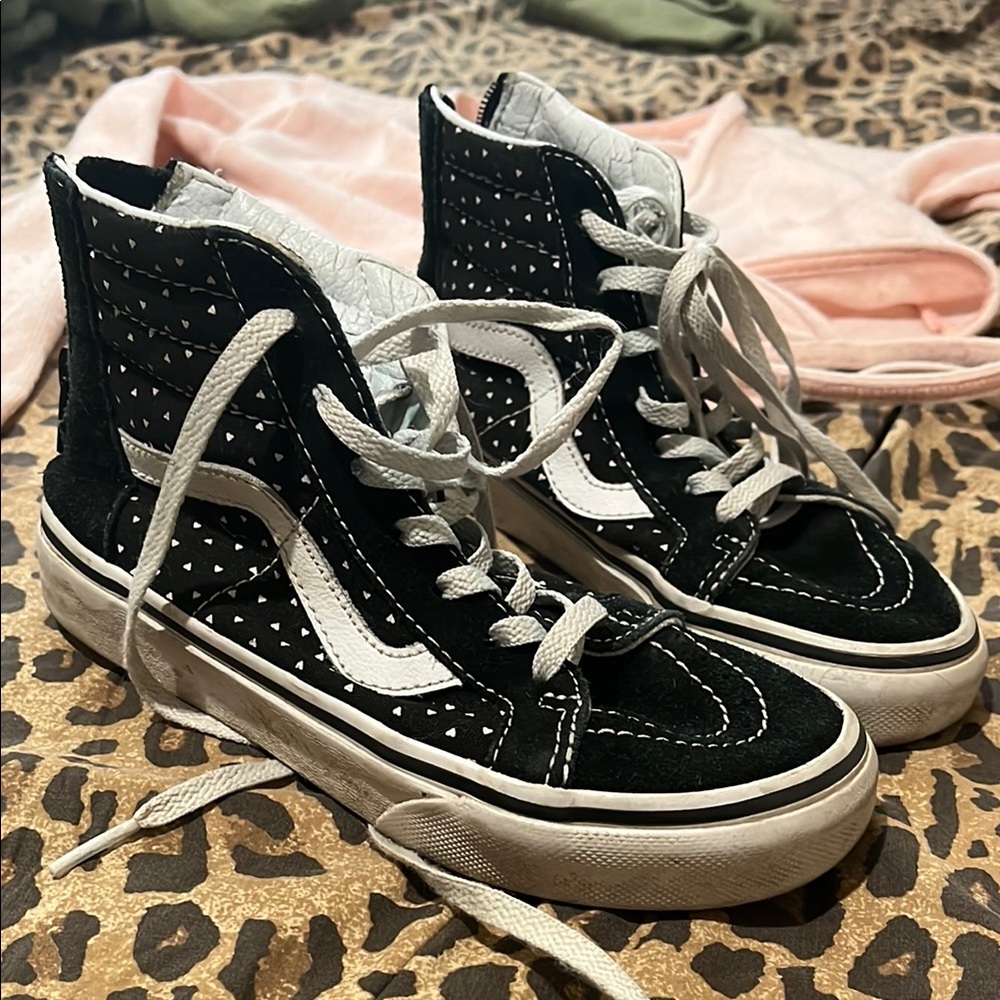 Vans high tops, zip, black w white hearts. Bought used, never worn. Size 13.5.